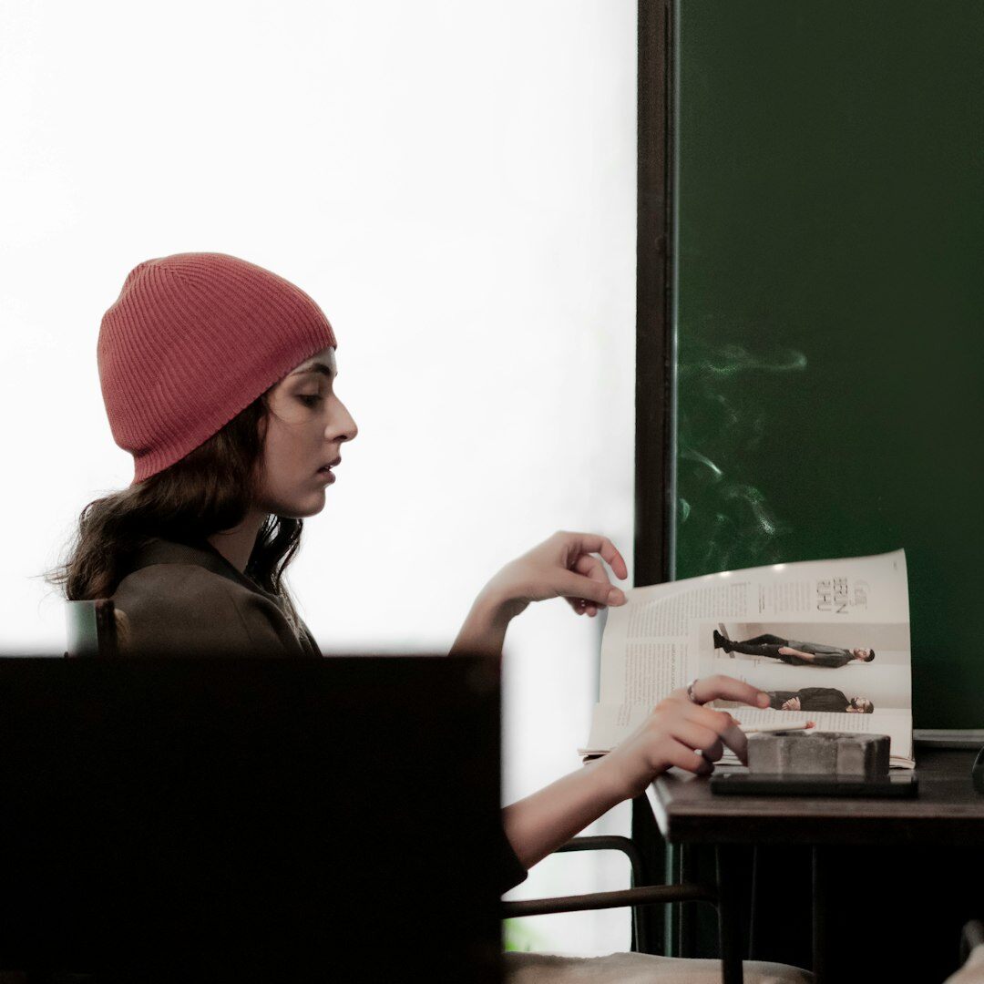 Portuguese woman developer reviewing code on a laptop screen