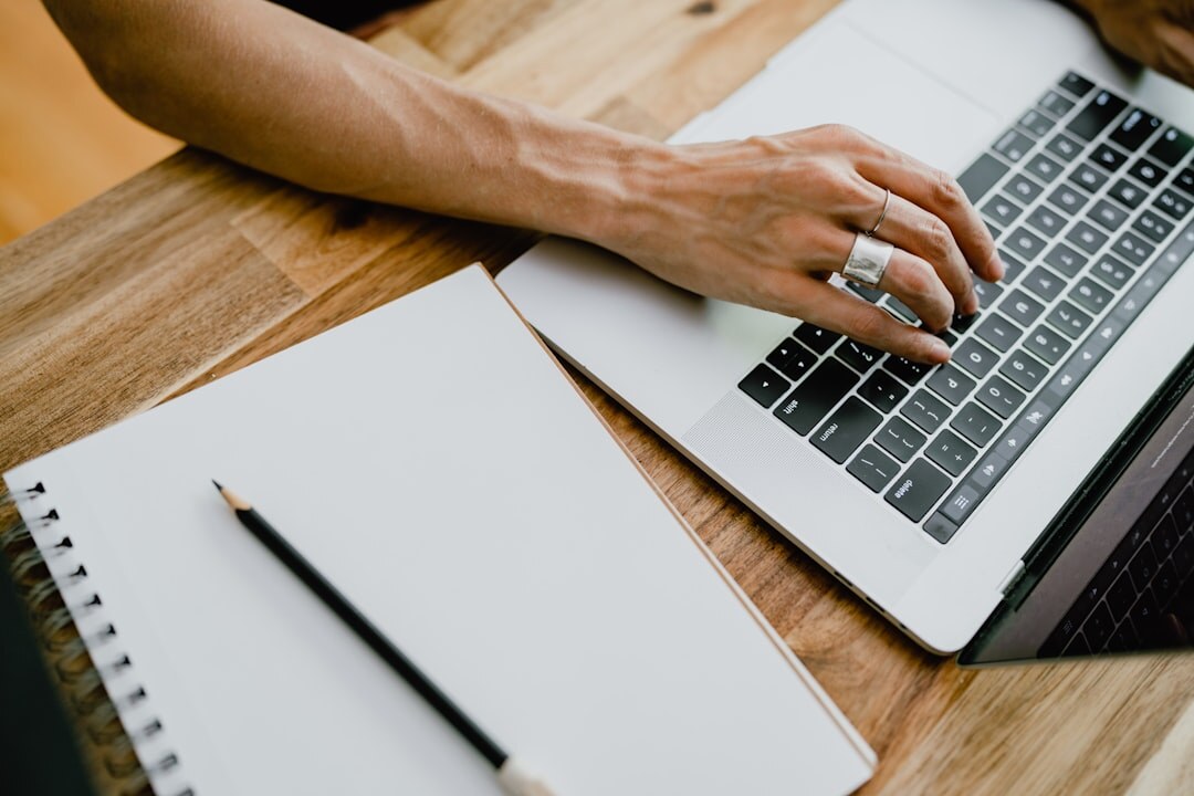 blogger writing on laptop