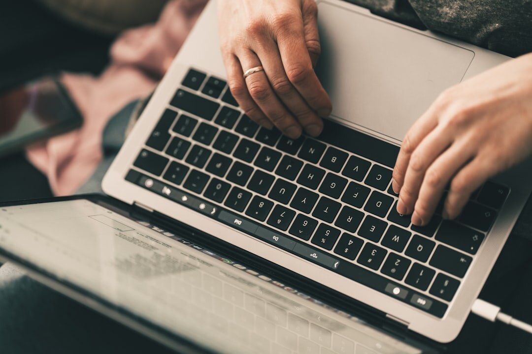 blogger writing on laptop