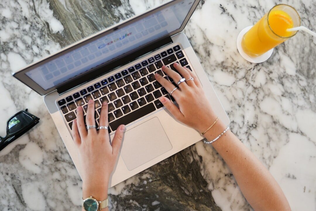 blogger typing on laptop