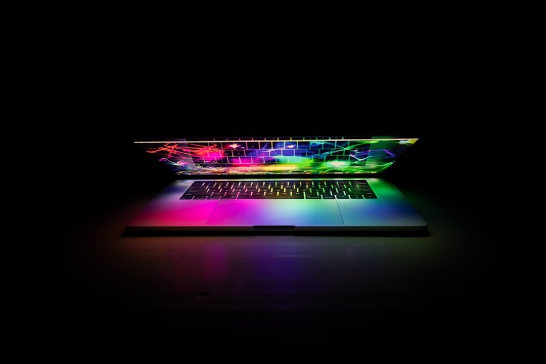 Laptop displaying a colorful interface design mockup